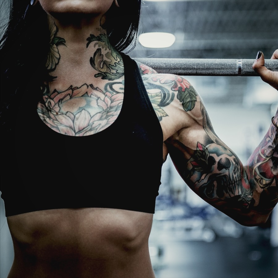 Athlete holding a barbell on her shoulders